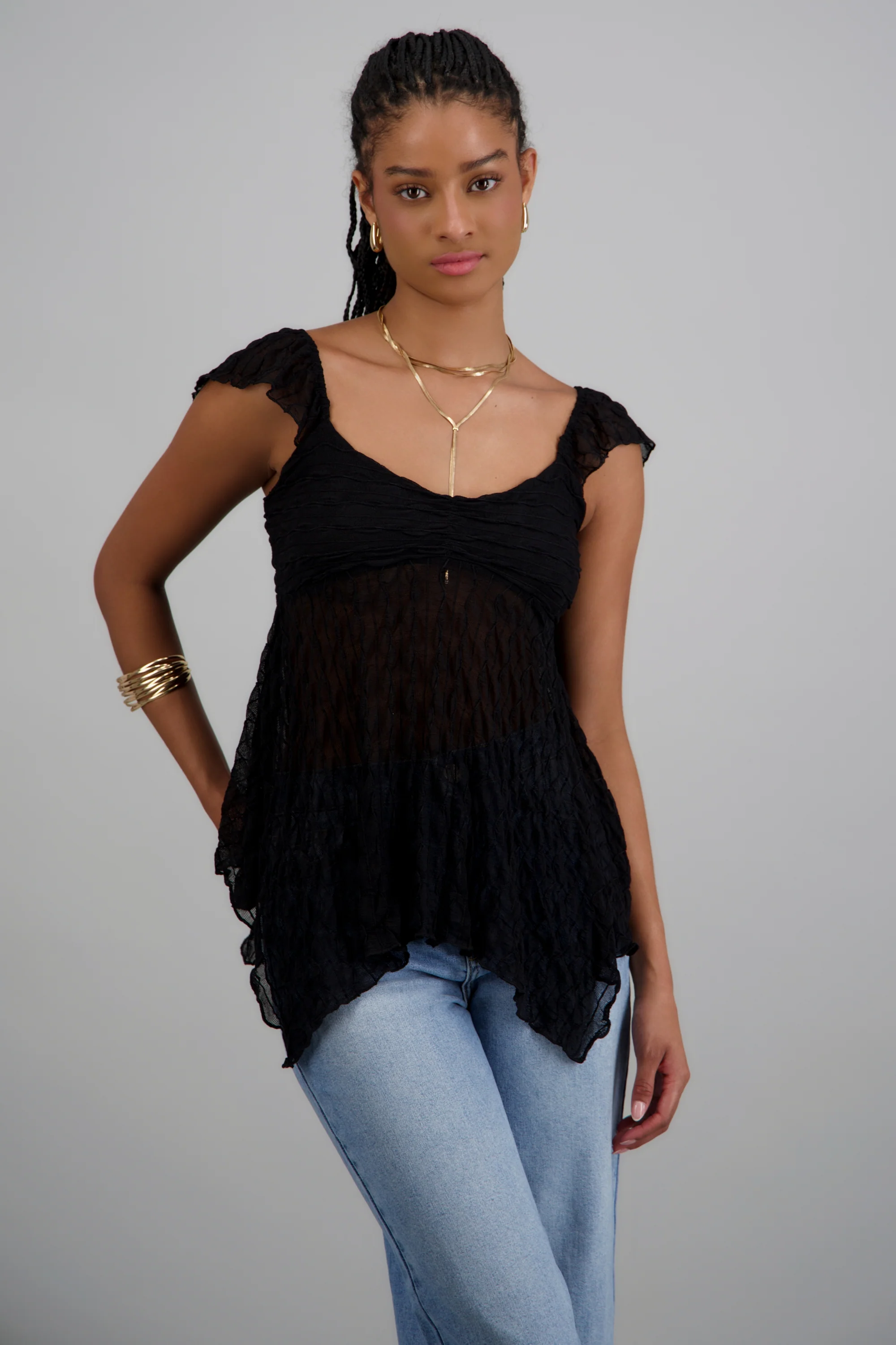 Blusa sin manga asimetrica con textura