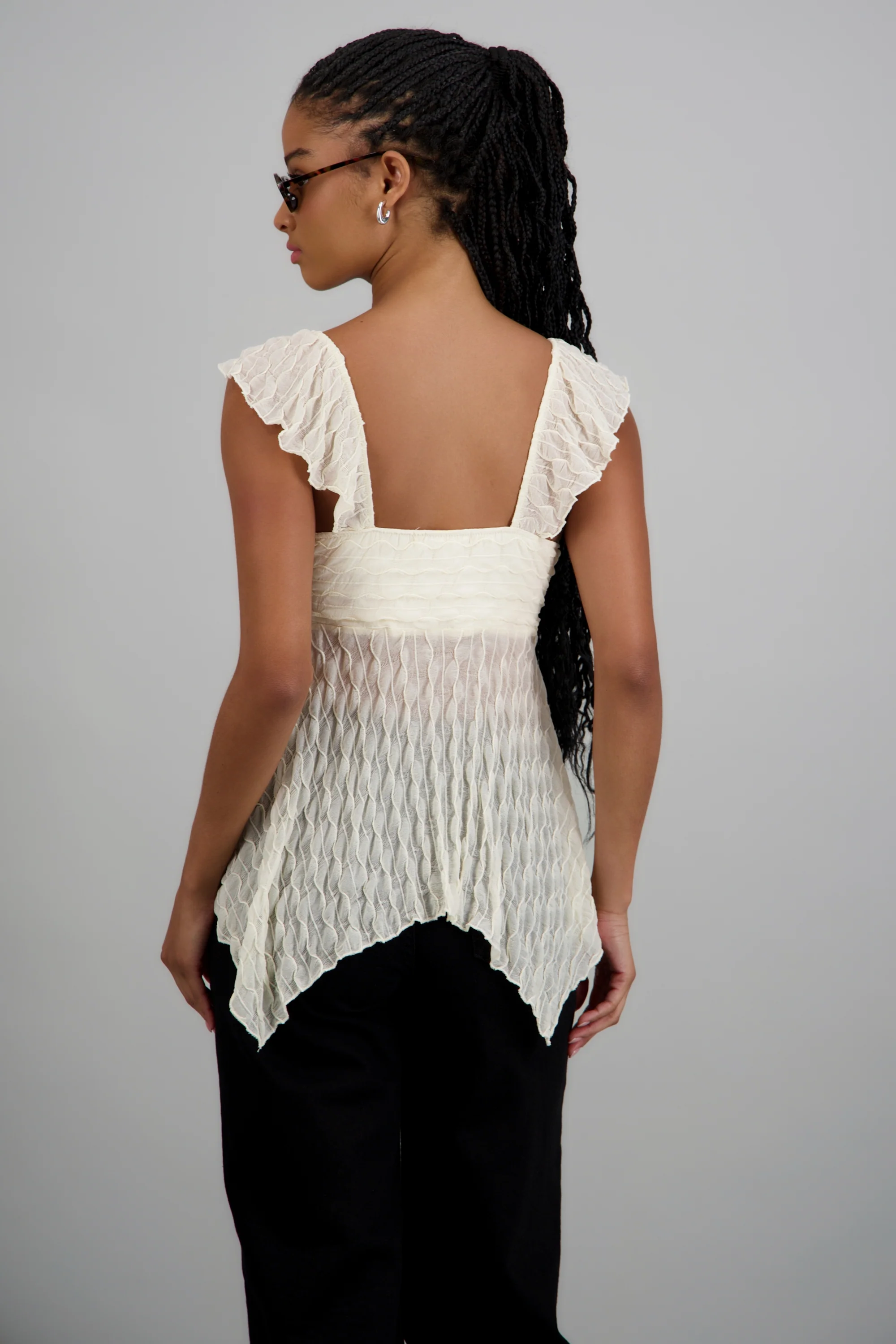 Blusa sin manga asimetrica con textura - Image 4